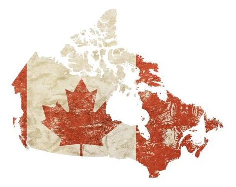 A vintage looking faded and distressed Canadian flag with red maple leaf isolated on white background