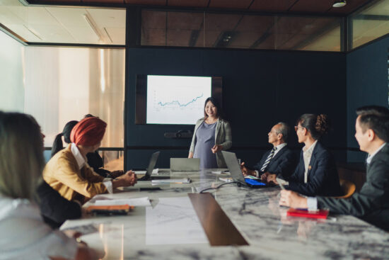 Business diversity - A multi ethnicity team composition including a pregnant lady