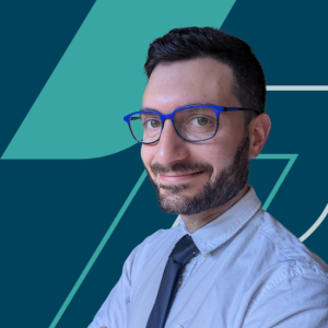 A photo of Eckler Principal Maxime Romano on a branded background that is dark navy with teal coloured flags.